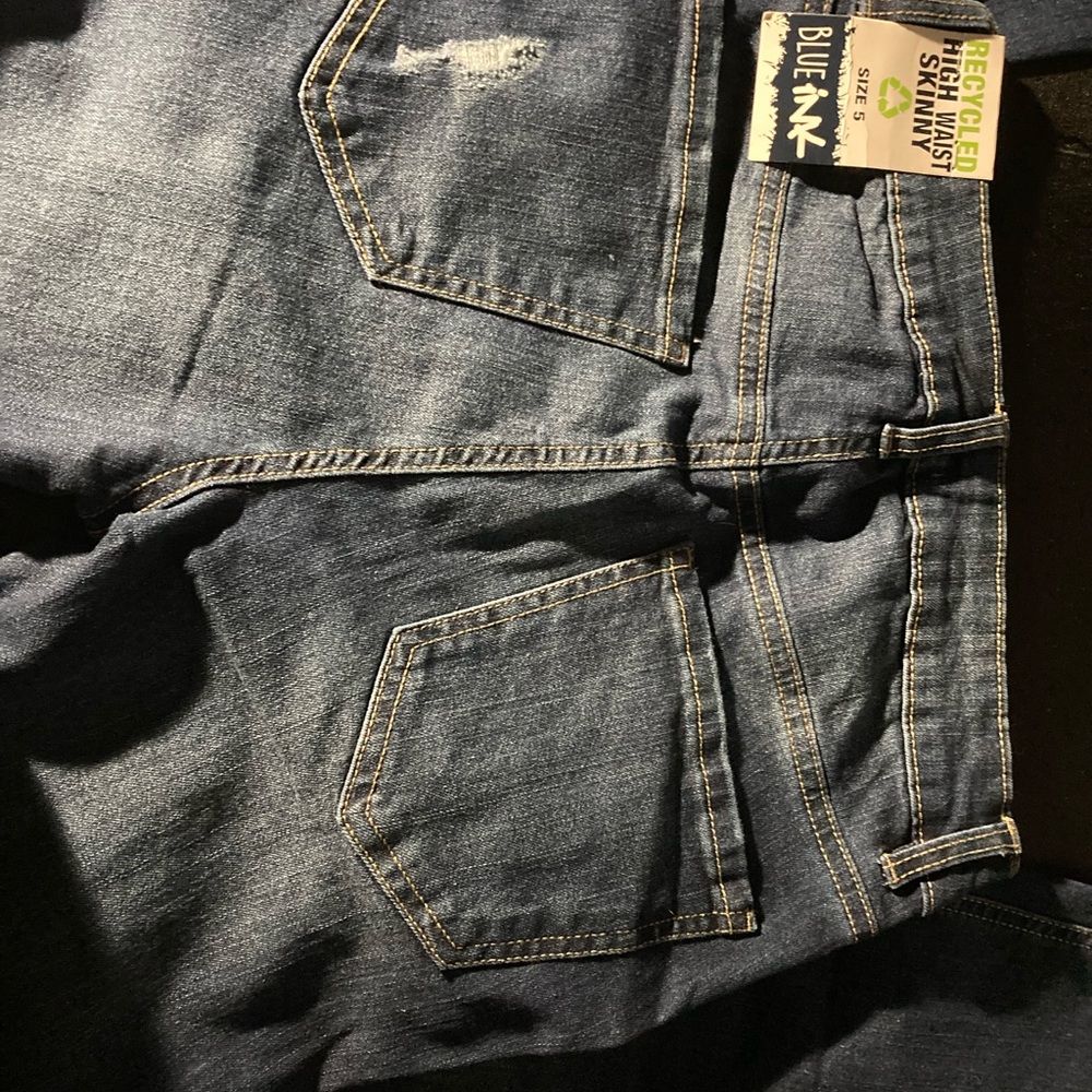 Dark blue ripped jeans